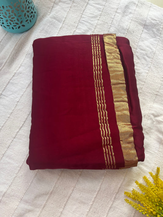 Dark Maroon Plain Modal Silk Saree with Tissue Palla and Tassels